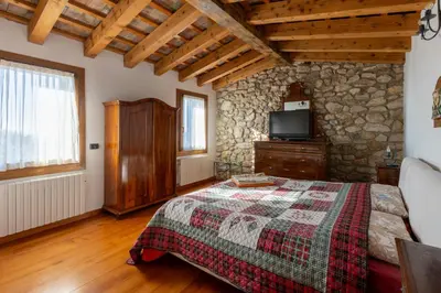 Letto o letti in una camera di Holiday House Petrarca