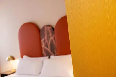 Letto o letti in una camera di Palazzina Fortuny