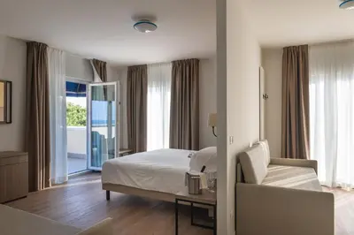 Letto o letti in una camera di Hotel Excelsior