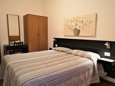 Letto o letti in una camera di Hotel Rossi