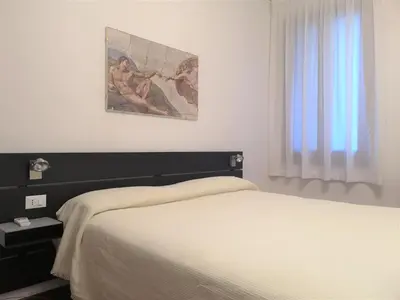 Letto o letti in una camera di Hotel Rossi