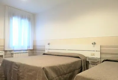 Letto o letti in una camera di Hotel Rossi