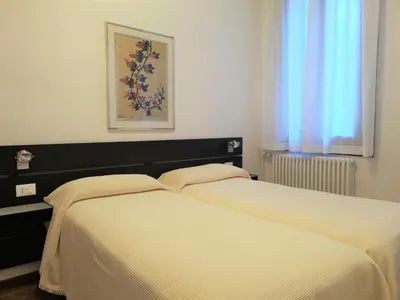 Letto o letti in una camera di Hotel Rossi