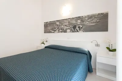 Letto o letti in una camera di Hotel Marina