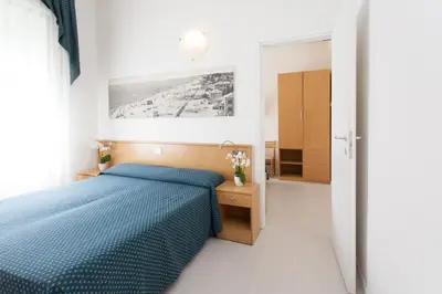Letto o letti in una camera di Hotel Marina