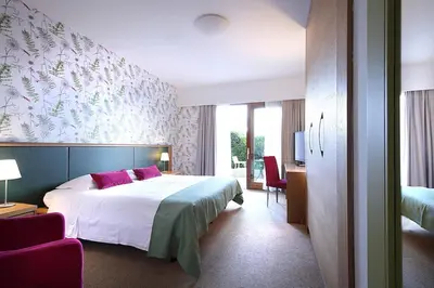 Letto o letti in una camera di Relais Le Betulle