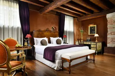 Letto o letti in una camera di Palazzo Venart Luxury Hotel