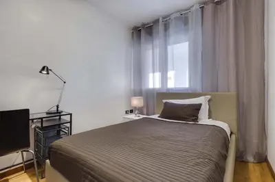 Letto o letti in una camera di Quartiere Padova 2000