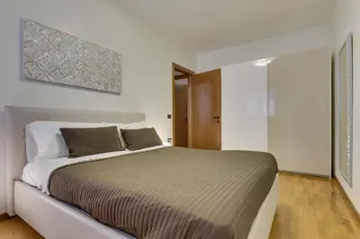Letto o letti in una camera di Quartiere Padova 2000
