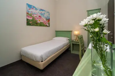 Letto o letti in una camera di Hotel Donatello
