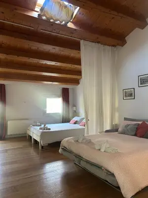 Letto o letti in una camera di BeeHouse - La Casa delle Api Agriturismo