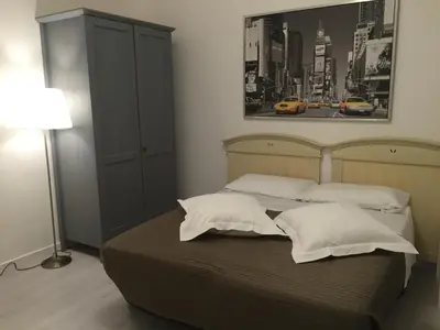 Letto o letti in una camera di Sunday Apartments