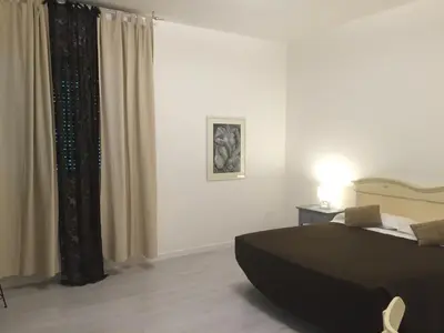 Letto o letti in una camera di Sunday Apartments