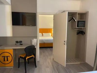 Letto o letti in una camera di Hotel Omnia