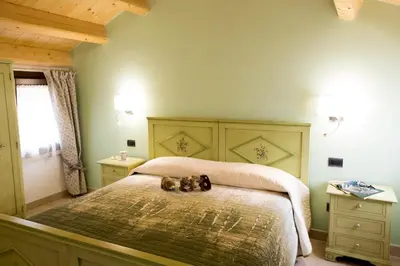 Letto o letti in una camera di Casa Sansovino