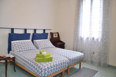 Letto o letti in una camera di Villino Lamberto