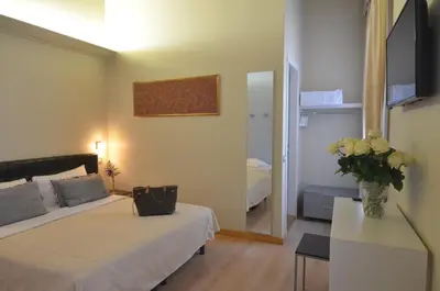 Letto o letti in una camera di Albergo al Tiepolo