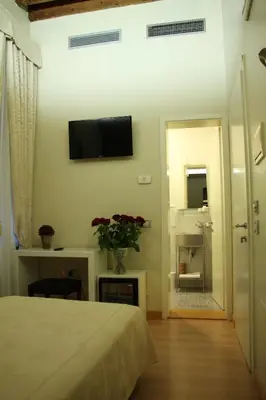 Letto o letti in una camera di Albergo al Tiepolo