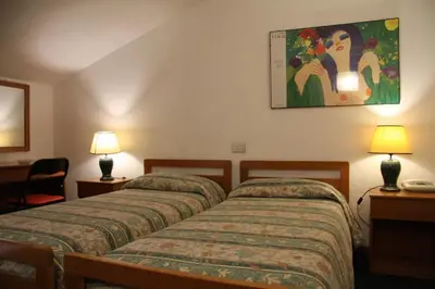 Letto o letti in una camera di Hotel Rizzi