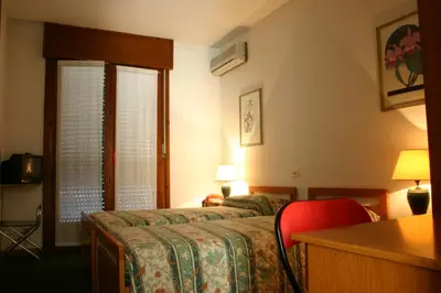 Letto o letti in una camera di Hotel Rizzi