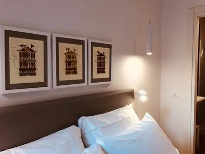 Letto o letti in una camera di San Marco Design Suites