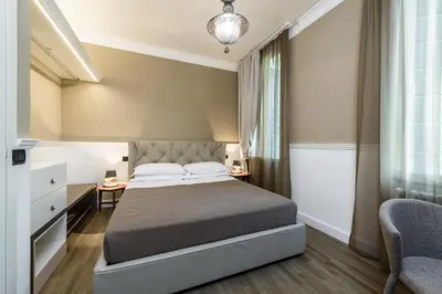 Letto o letti in una camera di Palazzo Bovio - Boutique Apartments