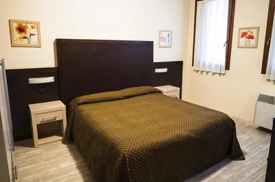 Letto o letti in una camera di B&B Villalta