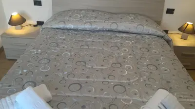 Letto o letti in una camera di Appartamento Ca' Lela