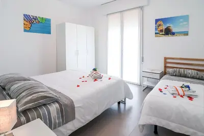 Letto o letti in una camera di Appartamenti Gherbin Jesolo