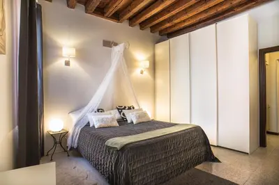 Letto o letti in una camera di Terrazzina - Romantic Pied A Terre at the heart of Cannaregio district