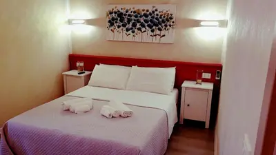 Letto o letti in una camera di Ai Colli