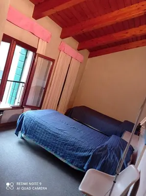 Letto o letti in una camera di Locanda Alla Stazione