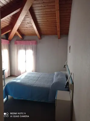 Letto o letti in una camera di Locanda Alla Stazione