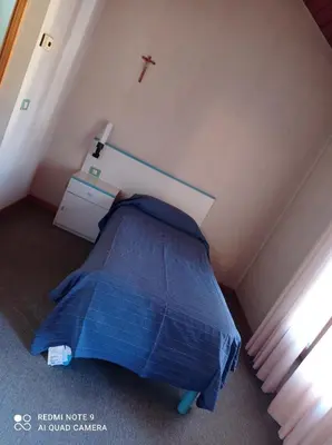 Letto o letti in una camera di Locanda Alla Stazione