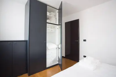 Letto o letti in una camera di Filodrammatici Loft by Welc(H)ome