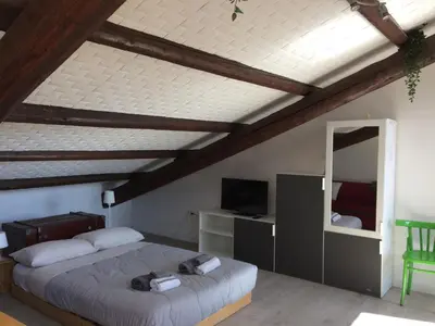Letto o letti in una camera di La mansardina