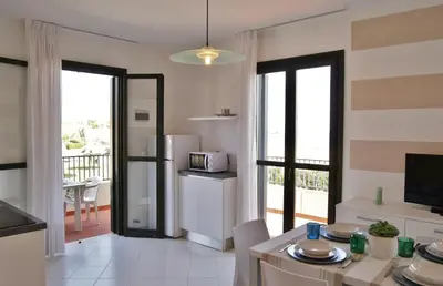 Cucina o angolo cottura di Appartamenti in Residence Portosole e Residence Tamerici con piscina-Cavallino Treporti