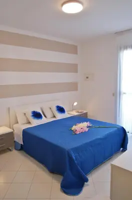 Letto o letti in una camera di Appartamenti in Residence Portosole e Residence Tamerici con piscina-Cavallino Treporti