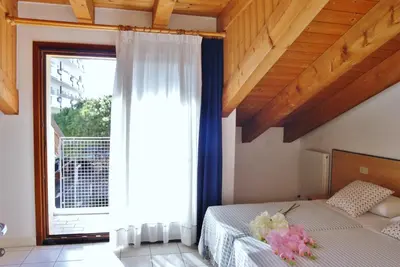 Letto o letti in una camera di Appartamenti Villa Paola-Pochi passi dal mare-Zona piazza Aurora-Lido di Jesolo