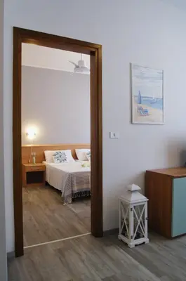 Letto o letti in una camera di Appartamenti Diplomatic-Residence Fronte mare-Piazza Torino-Lido di Jesolo