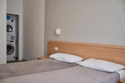 Letto o letti in una camera di Appartamenti Diplomatic-Residence Fronte mare-Piazza Torino-Lido di Jesolo