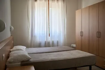 Letto o letti in una camera di Appartamenti Diplomatic-Residence Fronte mare-Piazza Torino-Lido di Jesolo