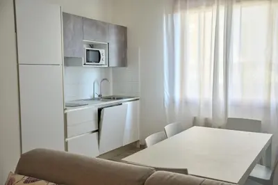 Cucina o angolo cottura di Appartamenti Diplomatic-Residence Fronte mare-Piazza Torino-Lido di Jesolo
