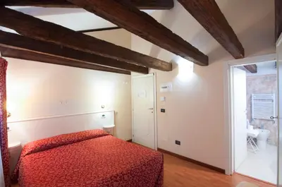 Letto o letti in una camera di Venice Resorts GuestHouse vicino Piazzale Roma e Stazione