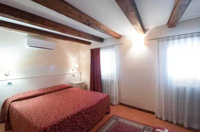 Letto o letti in una camera di Venice Resorts GuestHouse vicino Piazzale Roma e Stazione
