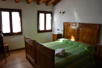 Letto o letti in una camera di Ca Borgh