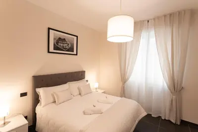 Letto o letti in una camera di Cà Sottomarina gli Appartamenti in Centro Apartsuite