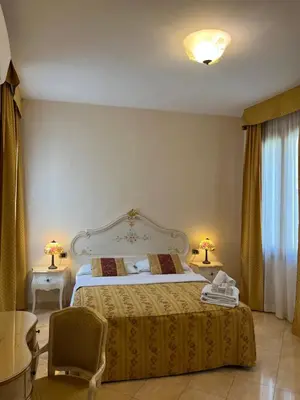 Letto o letti in una camera di Angeles Inn