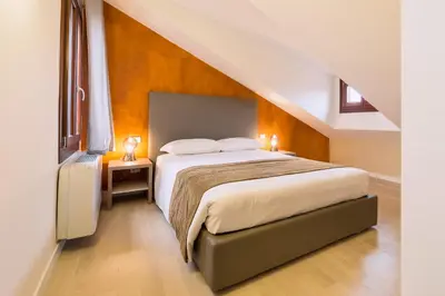 Letto o letti in una camera di Charming Palace Corte del Teatro