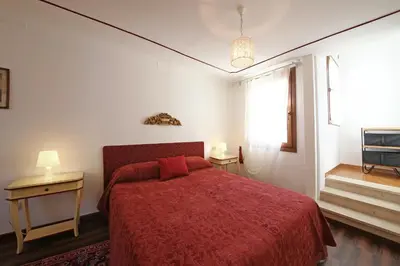 Letto o letti in una camera di Appartamenti inside Palazzo Foscarini